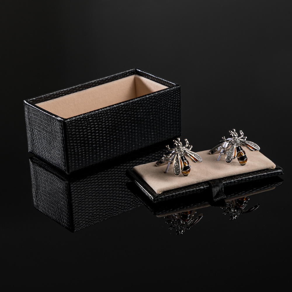 Bee shape metal cufflinks set with diamonds